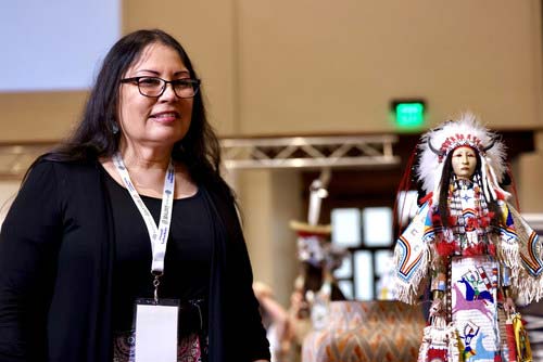 Best of Show Winner Rhonda Holy Bear Bear (Cheyenne River Sioux) and her winning Doll, “Lakota Honor- Sees the Horses Woman.” photo©Tira Howard for SWAIA/ Santa Fe Indian Market